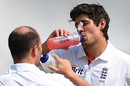 Alastair Cook and Jonathan Trott take a break during play
