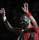 Novak Djokovic arrives on court in a Darth Vader mask