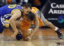 Golden State Warriors' Stephen Curry, left, and Phoenix Suns' Sebastian Telfair collide