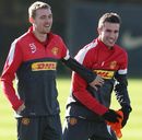Darren Fletcher and Robin van Persie laugh during training