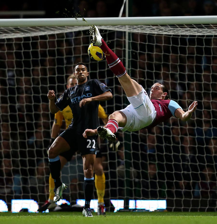 Andy Carroll attempts an overhead shot at goal