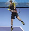 Andy Murray  plays a return to Tomas Berdych