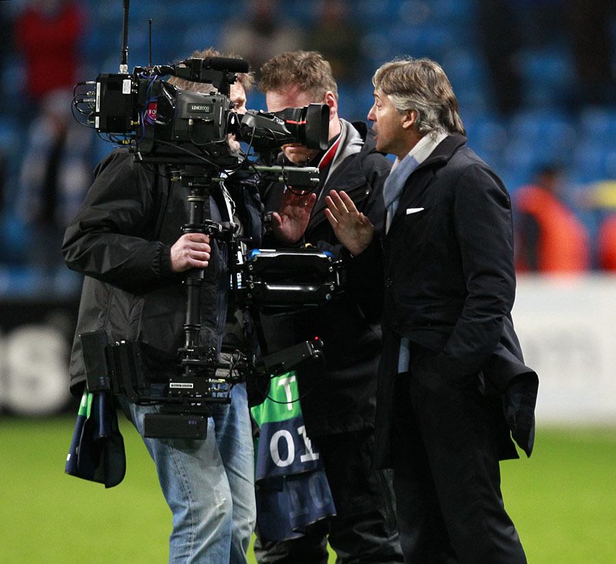 Roberto Mancini clashes with a cameraman