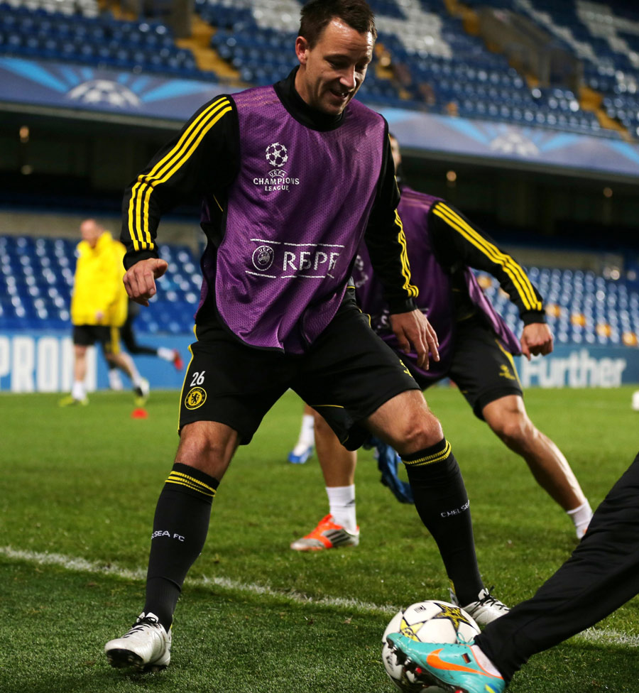 John Terry challenges for a ball in Chelsea training