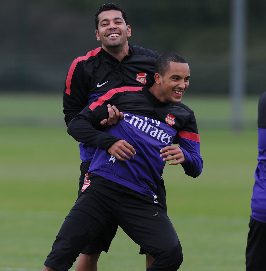 Andre Santos and Theo Walcott laugh during a training session