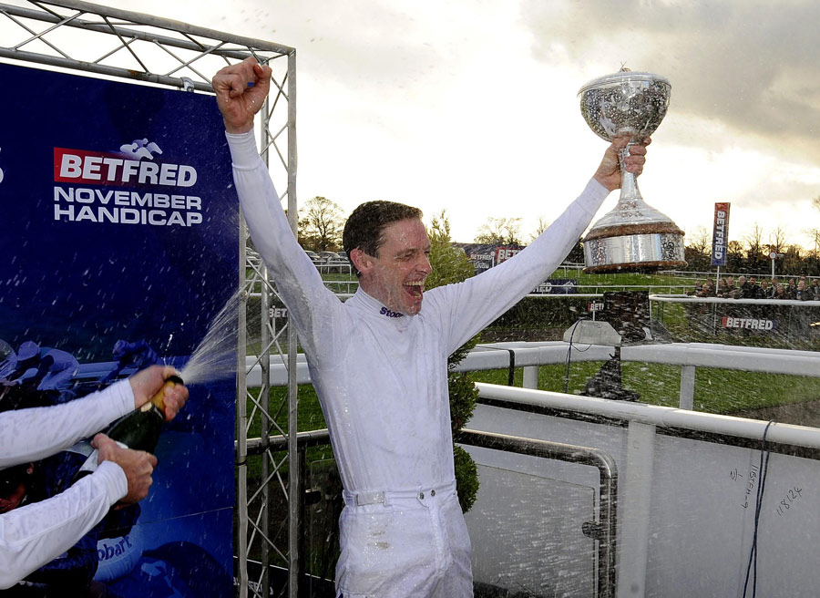 Richard Hughes celebrates being crowned champion Flat jockey