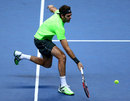 Juan Martin Del Potro returns a shot against Roger Federer