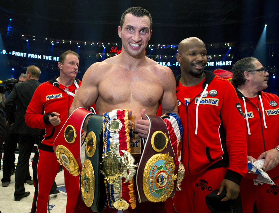 Wladimir Klitschko poses with his title belts