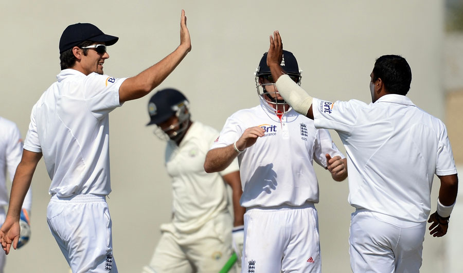 Alastair Cook congratulates Samit Patel on taking a wicket