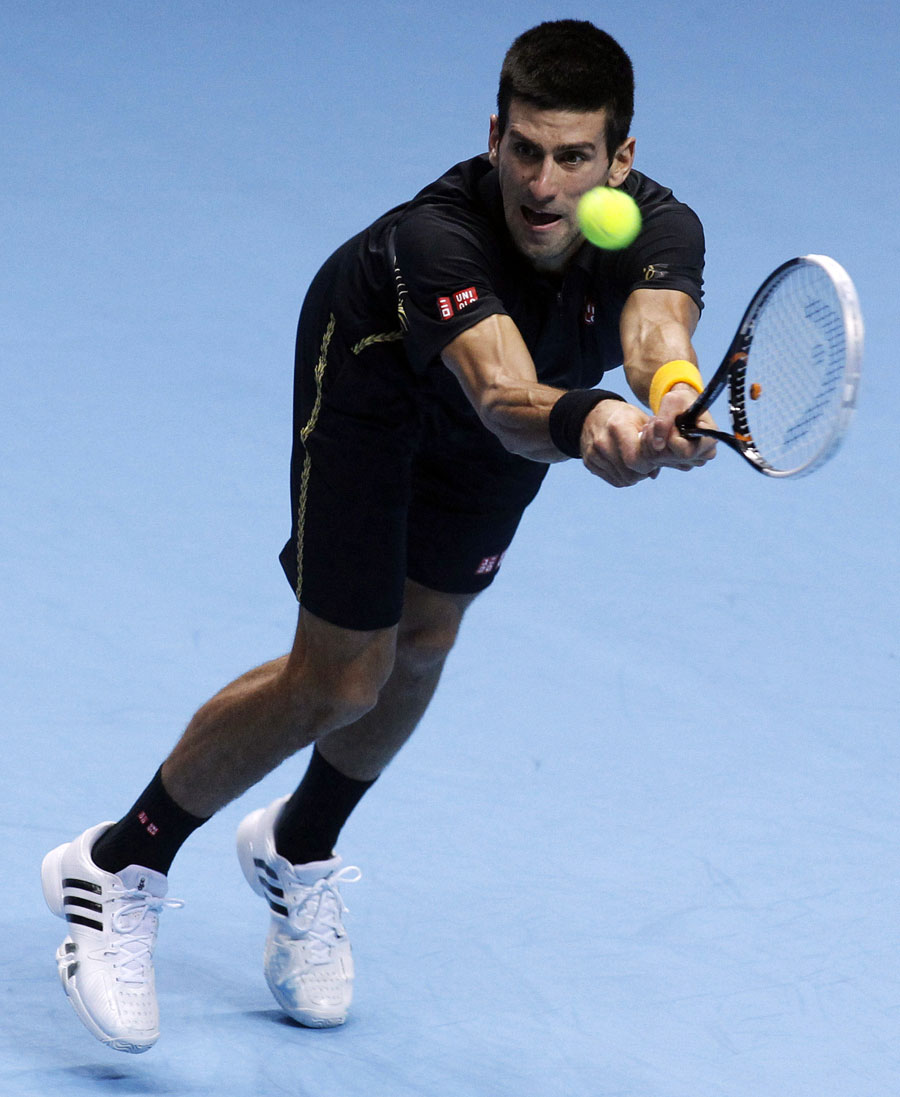 Novak Djokovic plays a return to Juan Martin Del Potro