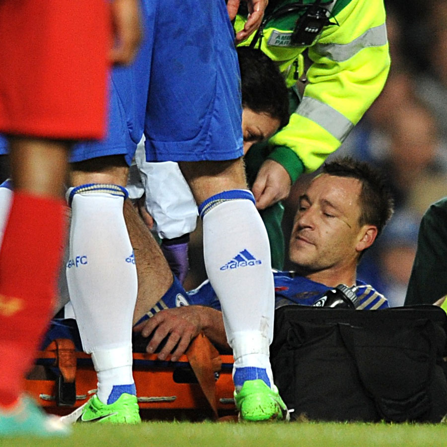 John Terry receives treatment on the pitch