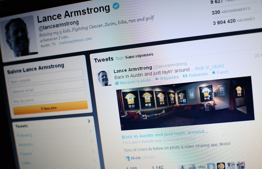 A picture of Lance Armstrong's Twitter page featuring a photo of him posing with his seven framed Tour de France winner's jerseys