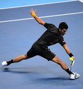 Novak Djokovic returns a shot against Roger Federer