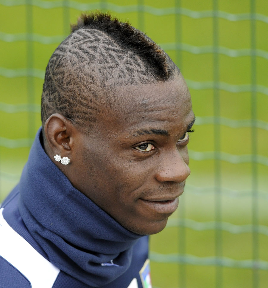 Mario Balotelli looks on during an Italy training session
