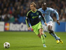 Christian Eriksen and Mario Balotelli compete for the ball