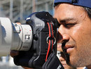 MS Dhoni tries to operate a camera