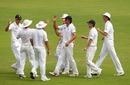 England players congratulate Jonathan Trott for his catch