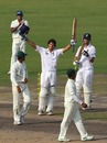 Alastair Cook celebrates after reaching his century
