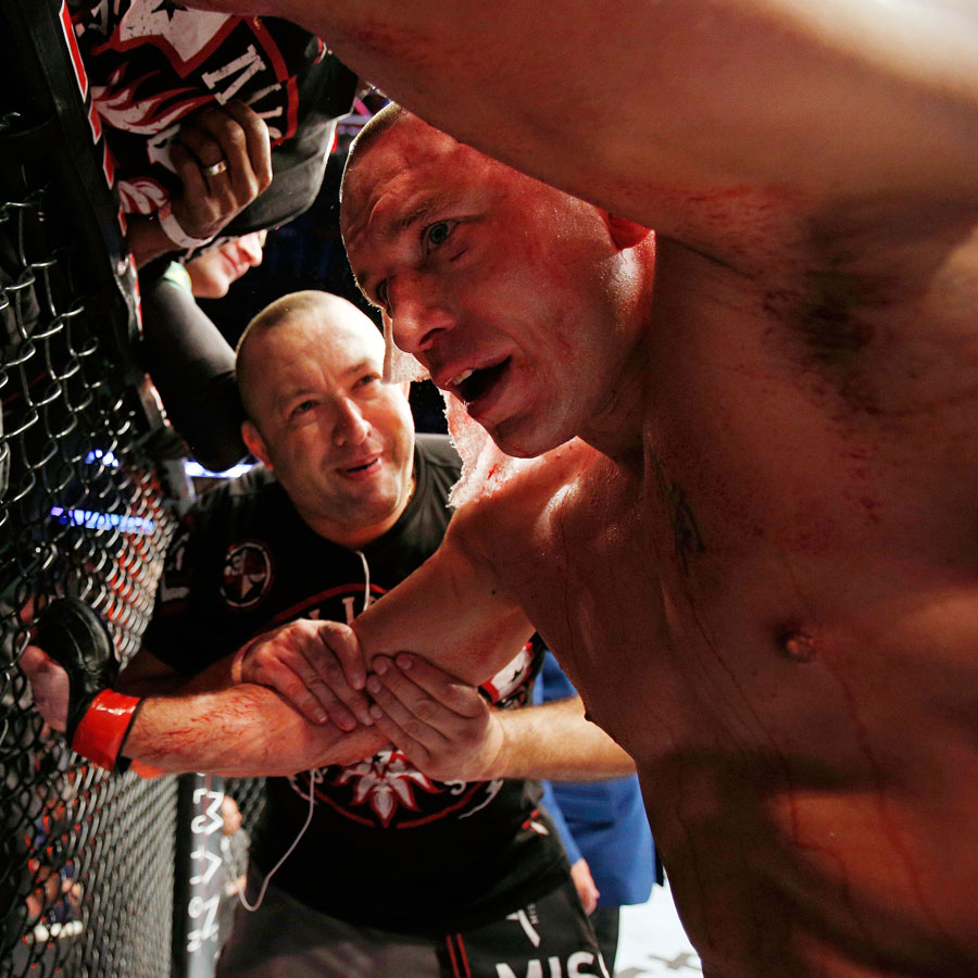 Georges St-Pierre reacts after fighting against Carlos Condit