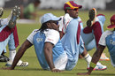 Chris Gayle stretches during training