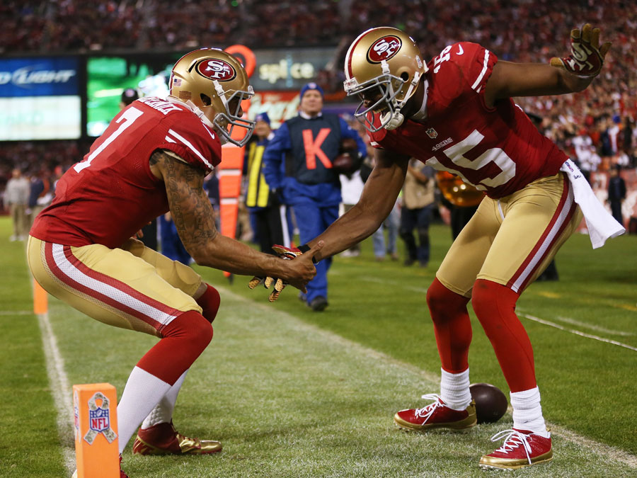 Michael Crabtree and Colin Kaepernick celebrate a touchdown