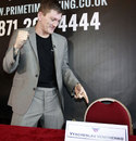 Ricky Hatton points at the chair where his opponent Vyacheslav Senchenko should have sat