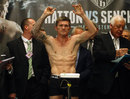 Ricky Hatton raises his arms during the weigh-in