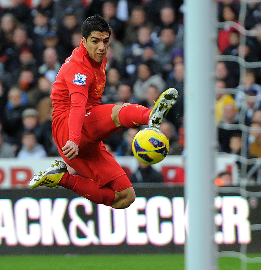 Luis Suarez attempts to control the ball