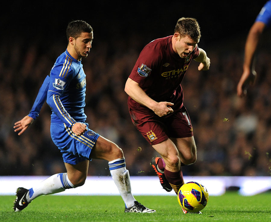 Eden Hazard and James Milner battle for the ball