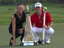 Rory McIlroy holds the trophy with girlfriend Caroline Wozniacki