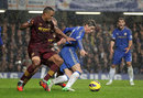 Fernando Torres and Vincent Kompany battle for the ball