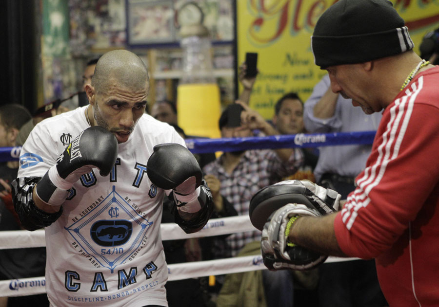 Miguel Cotto spars with trainer Pedro Diaz