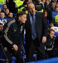Rafael Benitez talks to his coaching staff