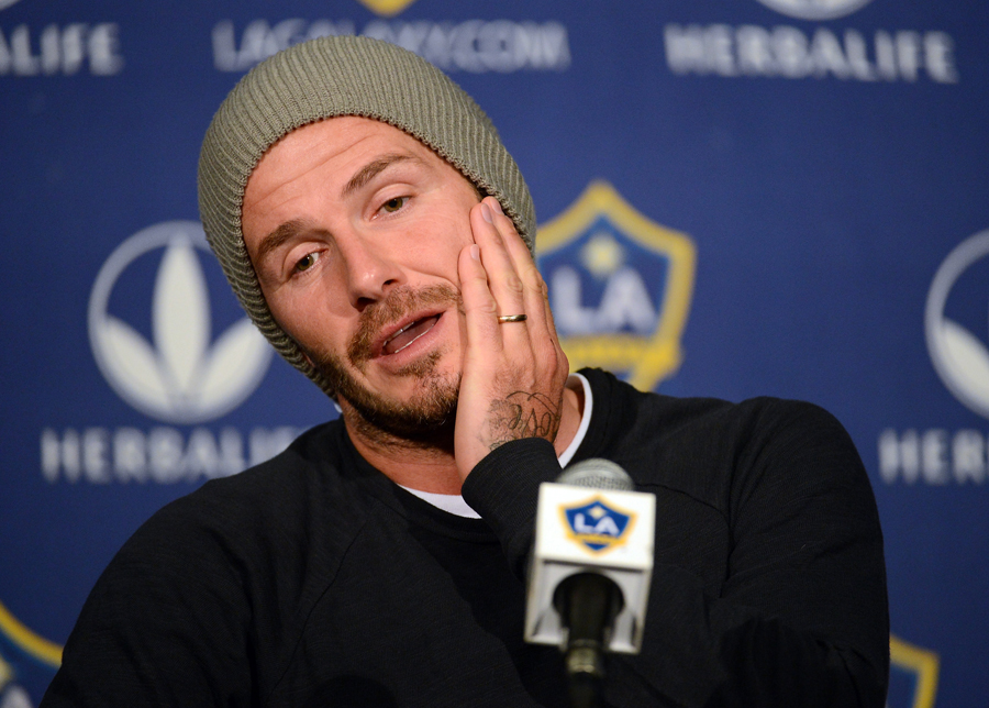 David Beckham talks with the media