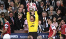 David Seaman holds aloft the FA Cup trophy