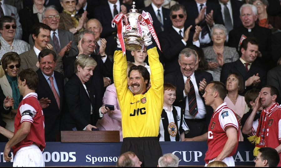 David Seaman holds aloft the FA Cup trophy