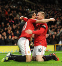Robin van Persie celebrates with Wayne Rooney
