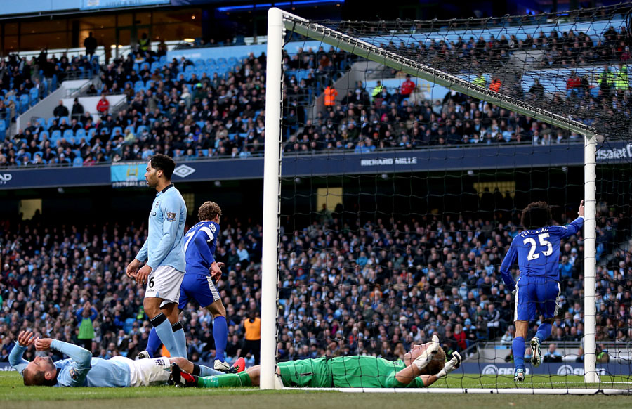 Marouane Fellaini wheels away after scoring against Manchester City