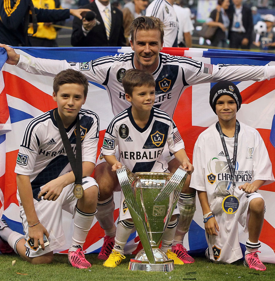 David Beckham poses with the MLS Cup