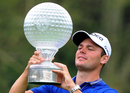 Martin Kaymer inspects his trophy