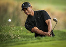 Tiger Woods plays out of a bunker