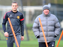 Nemanja Vidic walks to training with Sir Alex Ferguson