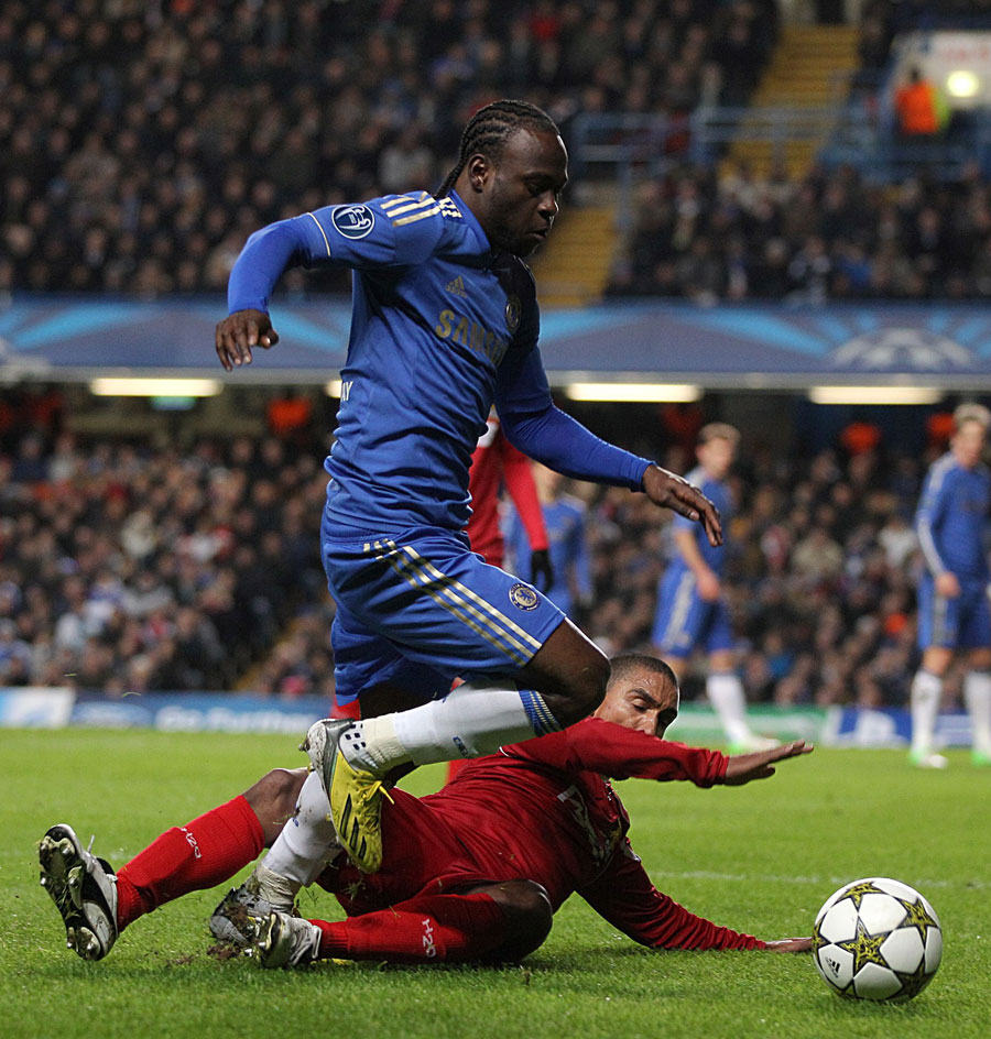 Victor Moses is tackled by Patrick Mtiliga