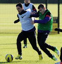 Mikel Arteta and Jack Wilshere battle during a training session