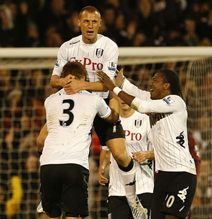 Fulham's Steve Sidwell (centre) celebrates scoring his side's first goal of the game