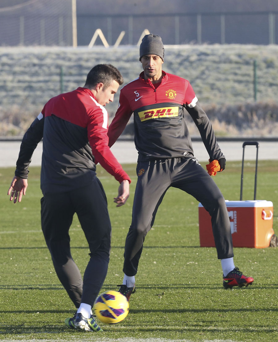 Rio Ferdinand trains with Robin van Persie