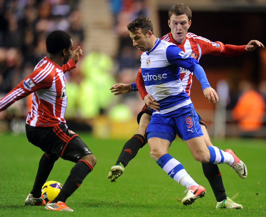 Reading's Adam Le Fondre is closed down by Craig Gardner and Danny Rose 