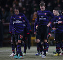 Marouane Chamakh and Per Mertesacker appear dejected