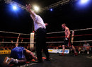 The referee calls an end to the fight after Lee Haskins is knocked to the canvas