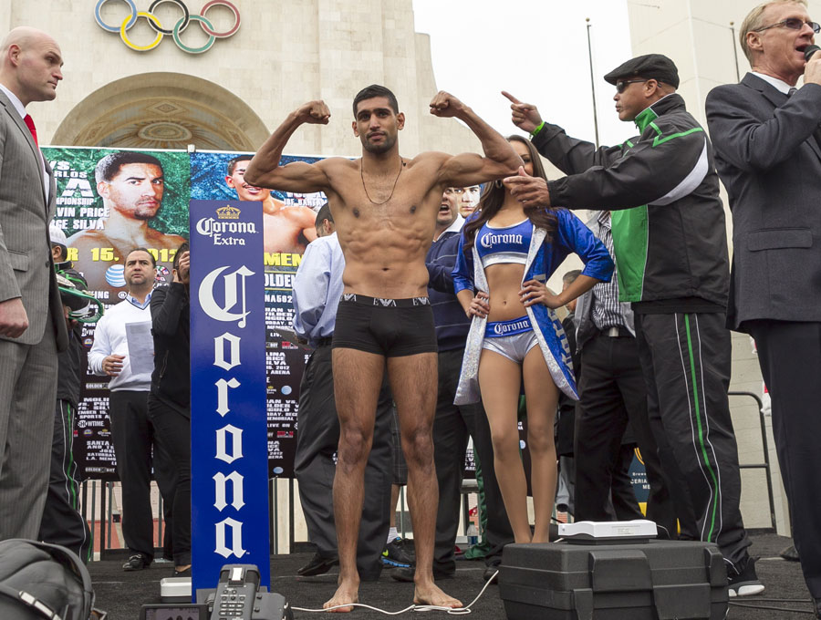 Amir Khan poses during the weigh-in